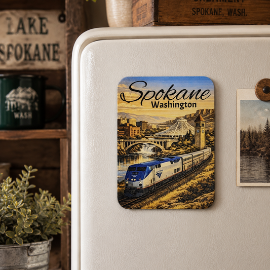 Fridge magnet with a train design and 'Spokane, Washington' text on a white refrigerator.