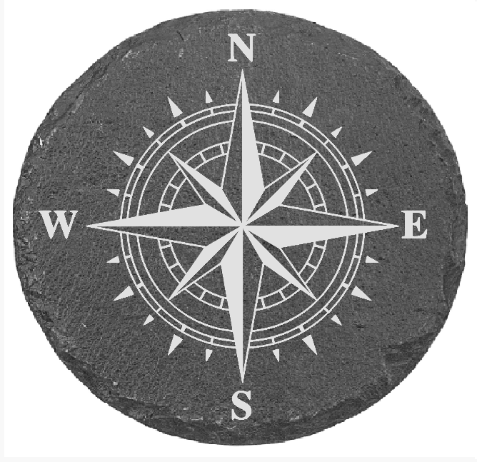 Round stone coaster with a compass rose design on a white background